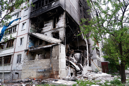 Damaged multi-apartment skyscrapers Russian planes and bombs.