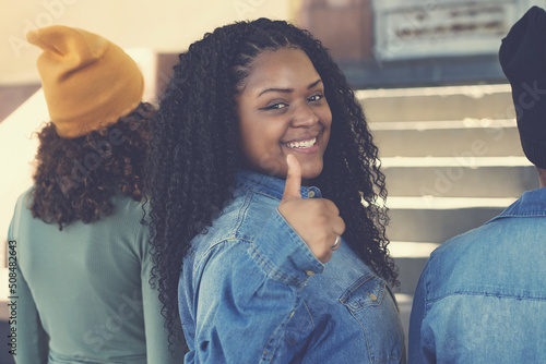 Fotografie Corpulent african american female young adult with group of friends