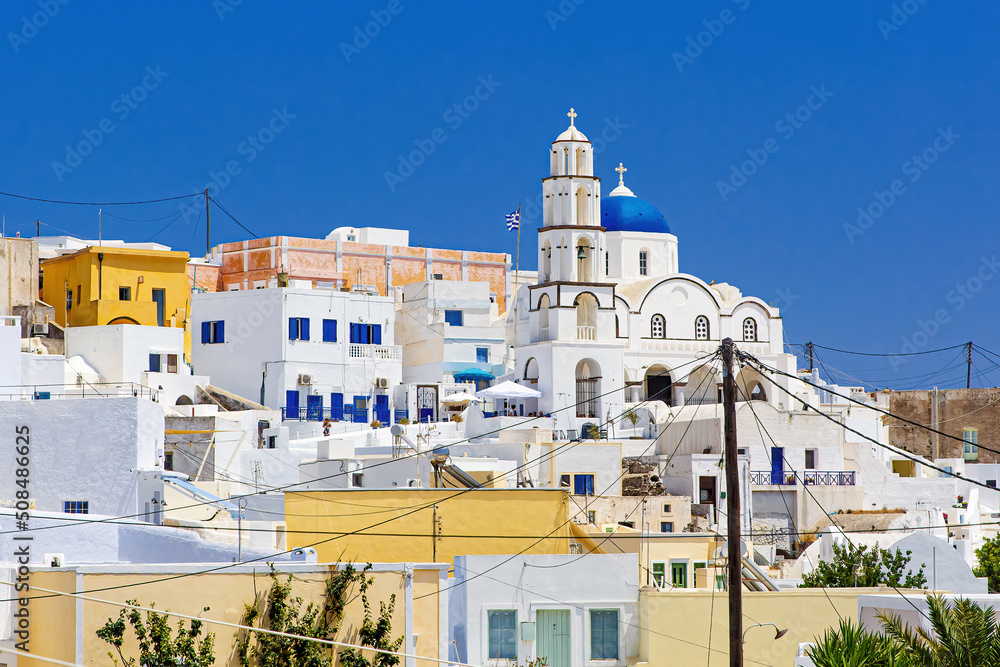 Traditional white architecture village on the center of Santorini island, Pyrgos Kallistis, Greece.