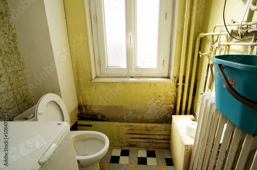 Disgusting bathroom in slum landlord apartment rental. Abandoned toilets in house. Careless tenant. Dirty restroom.