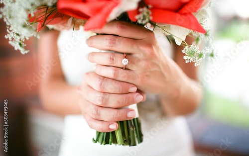 Fotobehang bride and groom holding hands
