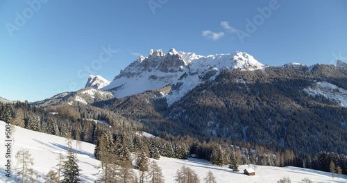 Beautiful winter landscape in the alps. Aerial view of snow covered mountains photo