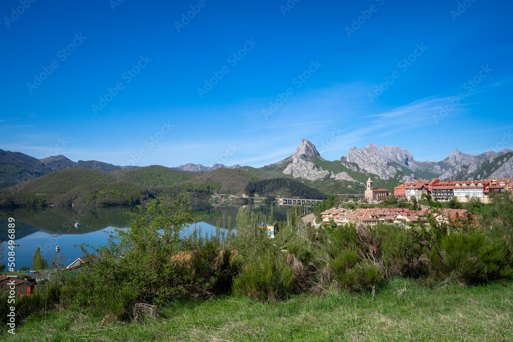 view of Riaño in a sunny day with the mountains in the background. León. Spain