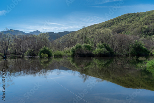 Reflection of the forest trees in the lake. Riaño. León. spain