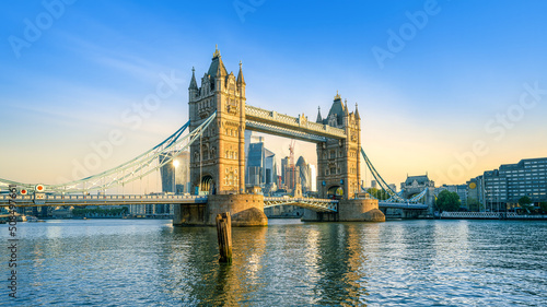 the famous tower bridge in london during sunrise photo