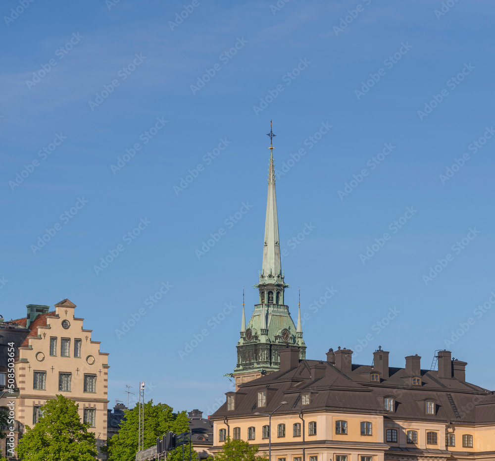 Old 1700s houses and the German church in the old town Gamla Stan an evening sunny summer day in Stockholm Old 1700s houses and the German church in the old town Gamla Stan an evening sunny summer day in Stockholm