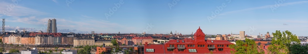 Evening panorama view of roofs and dorms of buildings and the skyscrapers Twin Tower in the district Vasa Stan a sunny summer day in Stockholm