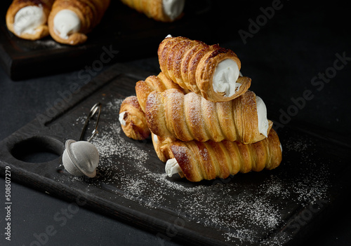 Baked tubules filled with whipped egg whites cream