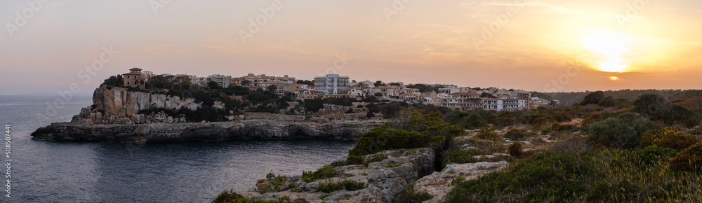 Spain, Mallorca, Panorama of the cliffs in Cala Figuera at sunset
