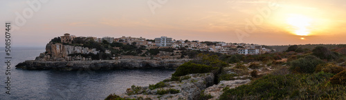Spain, Mallorca, Panorama of the cliffs in Cala Figuera at sunset