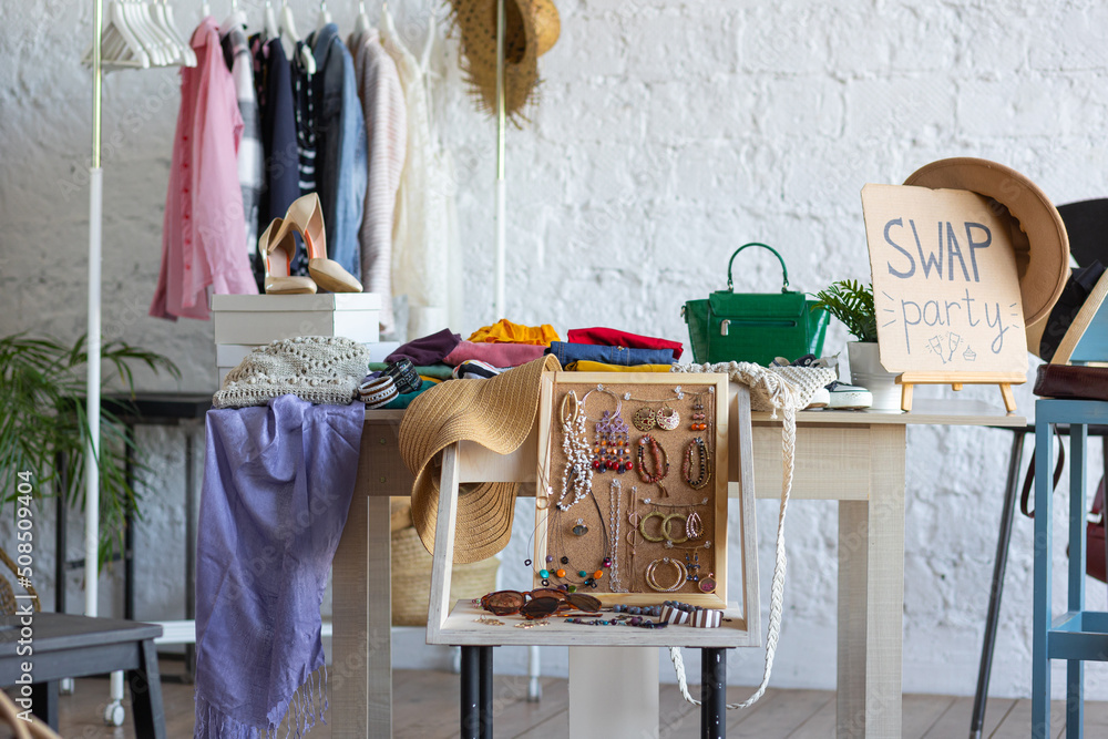 Foto Stock Swap home party - clothes, shoes, bags, jewellery exchange  between friends. Zero waste shopping, eco friendly concept, sustainable  lifestyle. College life | Adobe Stock