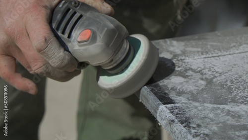 Work with a grinder on granite stone. Polishing of granite surface.
