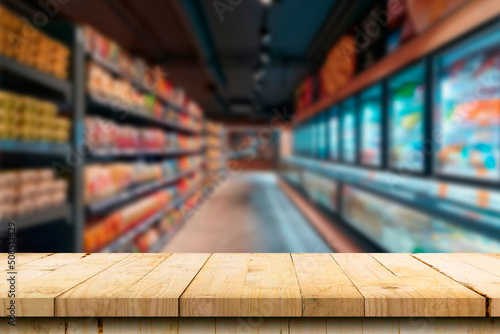 Empty wood table top on blurred market fruit. can montage or display your products