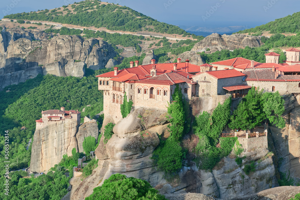 Stone monastery in the mountains. Kalabaka, Greece summer cloudy day in Meteora mountain valley. close up