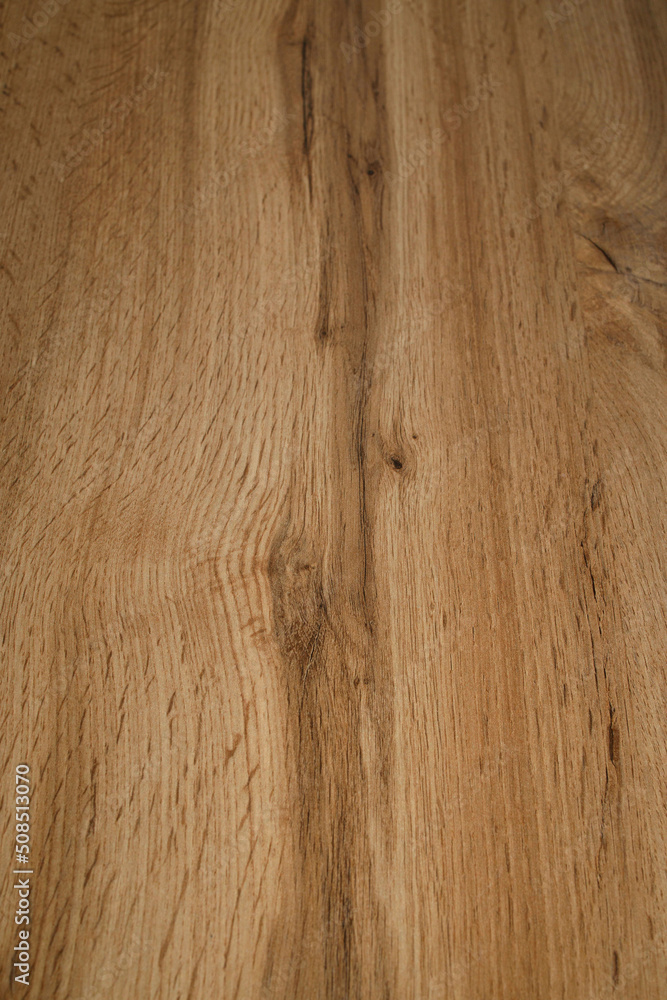 Fototapeta premium Wooden background texture. Light brown surface of old knotty wood with a natural color