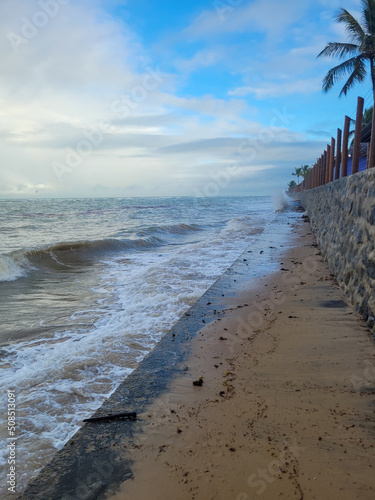 fisherman's beach with clouds and shy sun after rain, Arrial D'Ajuda, Bahia, Brazil photo