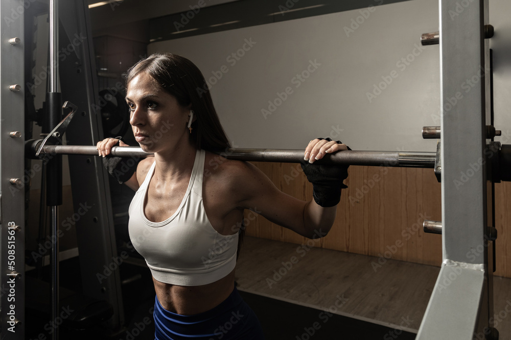 Closeup portrait of empowered female weightlifter Closeup portrait of empowered female weightlifter