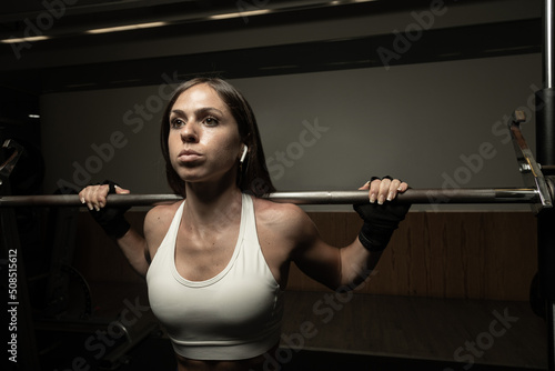 Closeup portrait of empowered female weightlifter