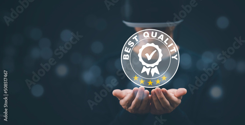 Man wearing VR glasses virtual hand hold Quality assurance of business services, Businessman Hand shows the sign of the top service Quality assurance in Black background , Guarantee, Standards, ISO