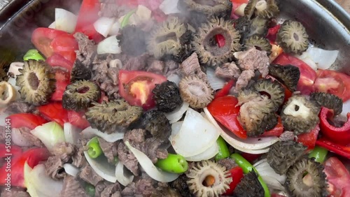 Preparation of morel mushroom mixed meal with meat and vegetables and camping tea photo