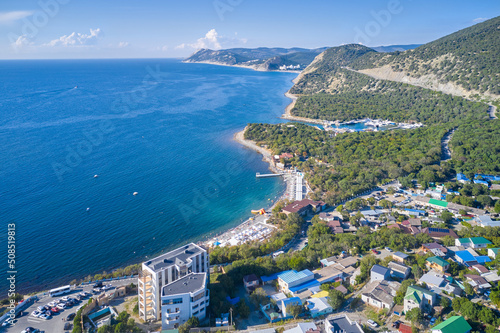 A small resort village of Bolshoy Utrish on the Black Sea coast. Coastline with infrastructure. Shooting from a drone.