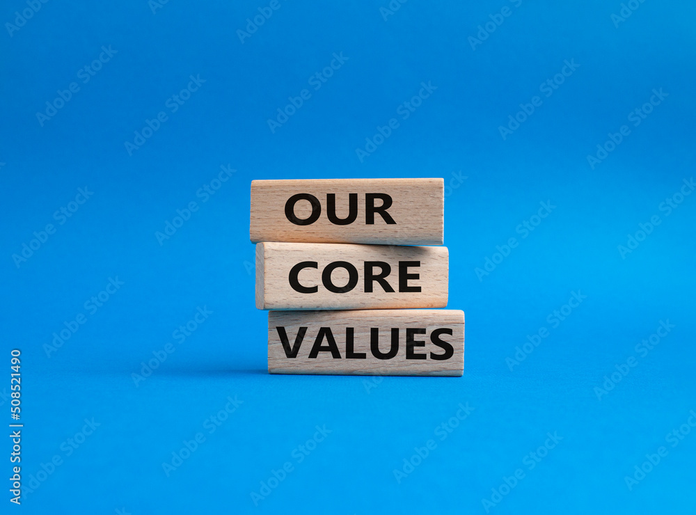 Our core values symbol. Concept words 'Our core values' on wooden blocks. Beautiful blue background. Business and Our core values concept. Copy space. Our core values symbol. Concept words 'Our core values' on wooden blocks. Beautiful blue background. Business and Our core values concept. Copy space.