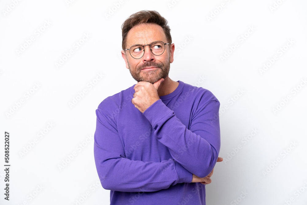 Middle age caucasian man isolated on white background thinking an idea while looking up Middle age caucasian man isolated on white background thinking an idea while looking up