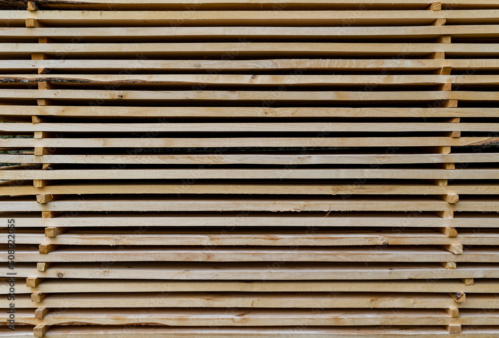 Stacked wooden boards in a line. Wooden background Stacked wooden boards in a line. Wooden background