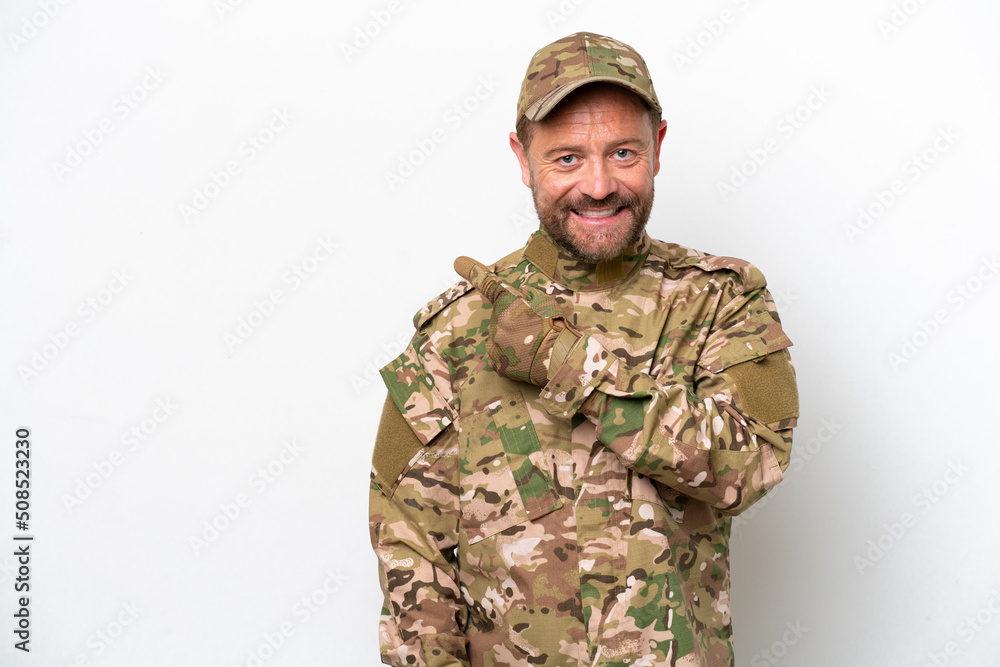 Military man isolated on white background pointing to the side to present a product Military man isolated on white background pointing to the side to present a product