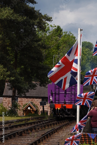the taw valley re painted purple to celebrate the queens platinum jubilee traveling through Hampton Loade on its first trip since being re-named photo