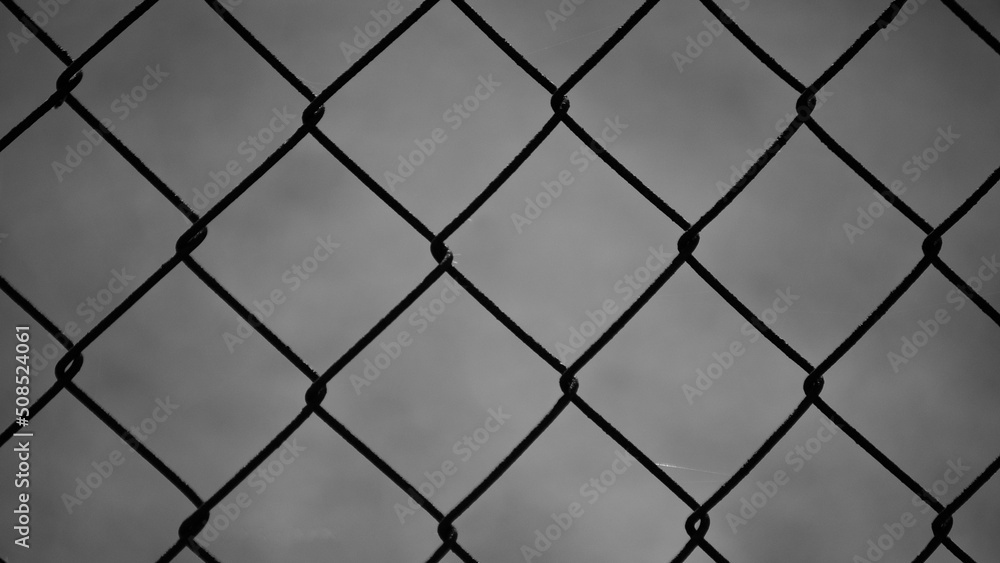 metal mesh,in the photo a mesh on a gray background metal mesh,in the photo a mesh on a gray background