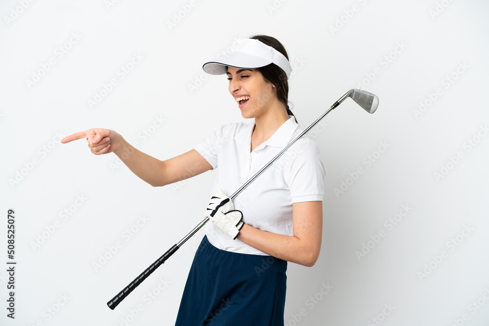 Handsome young golfer player woman isolated on white background pointing finger to the side and presenting a product Handsome young golfer player woman isolated on white background pointing finger to the side and presenting a product