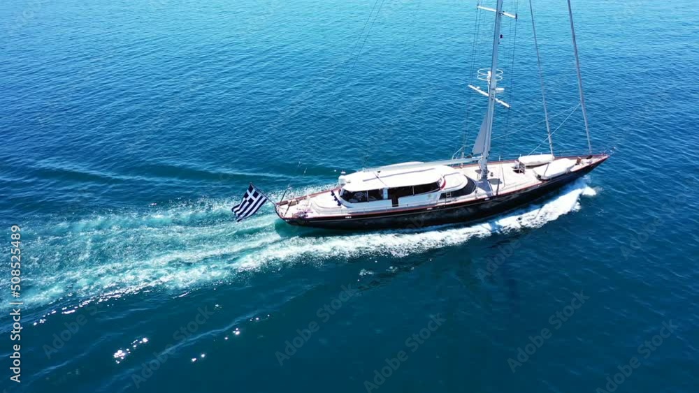 Aerial drone tracking loop video of beautiful sailboat cruising in deep blue Aegean sea, Greece Aerial drone tracking loop video of beautiful sailboat cruising in deep blue Aegean sea, Greece