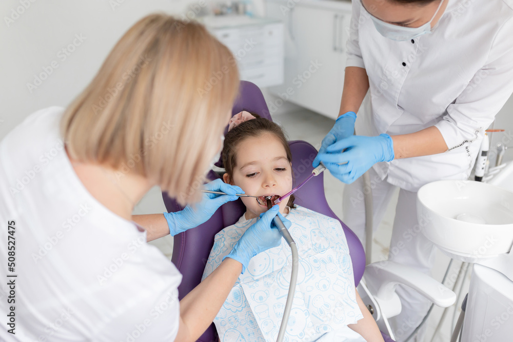 Child to the dentist. Child in the dental chair