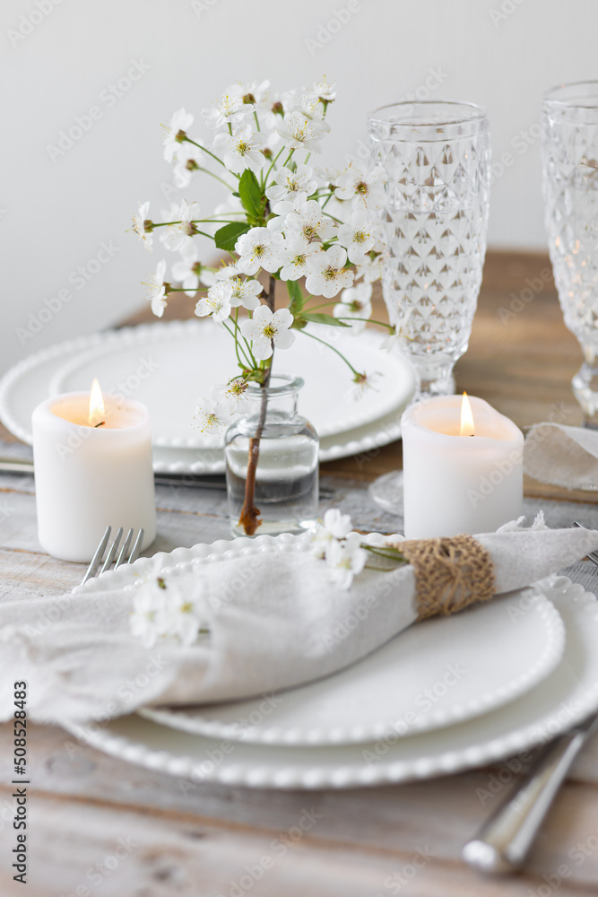 Rustic zero waste wedding decor with natural elements. Wooden table, candles, linen napkins, branches with green leaves. Eco-friendly decoration for the special dinner. Romantic and cozy place Rustic zero waste wedding decor with natural elements. Wooden table, candles, linen napkins, branches with green leaves. Eco-friendly decoration for the special dinner. Romantic and cozy place