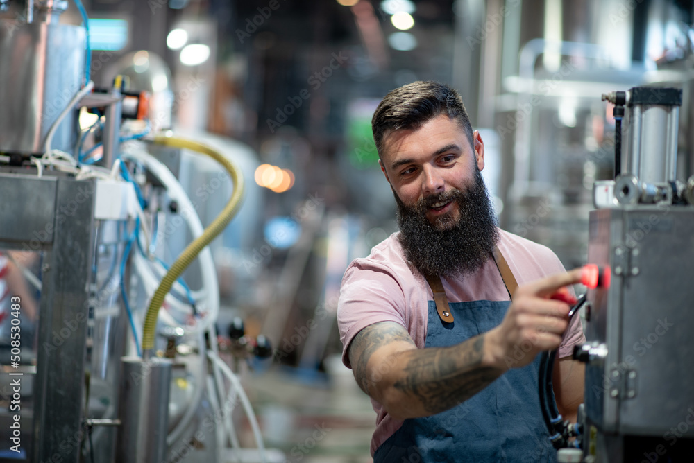 Portrait of a bearded man working in a brewery Portrait of a bearded man working in a brewery