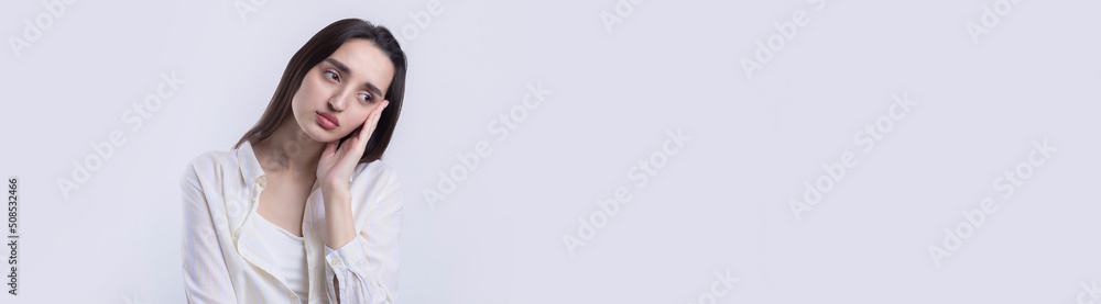 Portrait of a beautiful young woman thinking, isolated on white background Portrait of a beautiful young woman thinking, isolated on white background