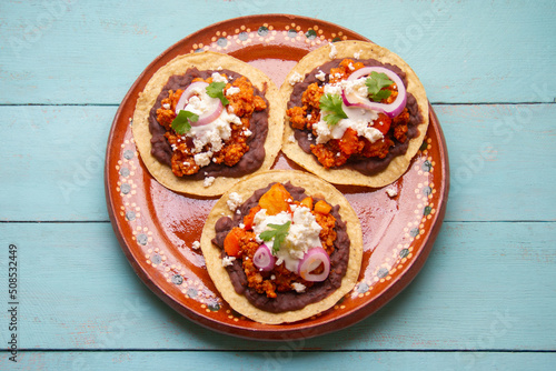 picadillo corn tostadas with cheese and beans. Mexican food photo