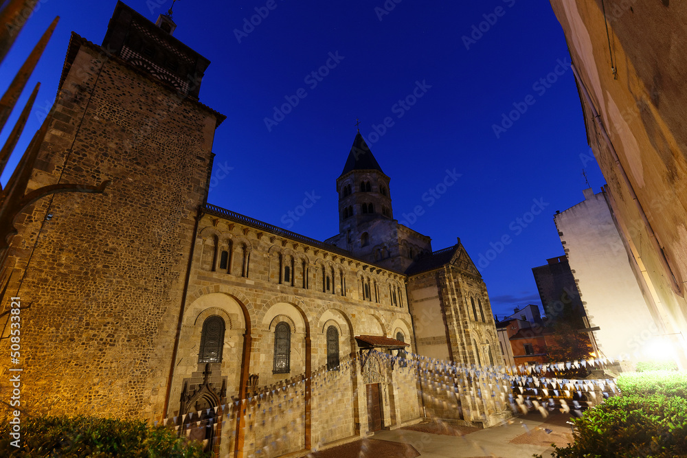 Fototapeta premium View of Romanesque church Notre Dame du Port. Church was founded by bishop of Clermont, Saint Avitus, in 6th century. Clermont Ferrand. Auvergne. France.