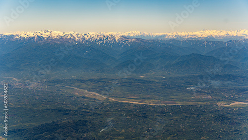 panorama of beautiful green valley and snowy mountains. High quality photo