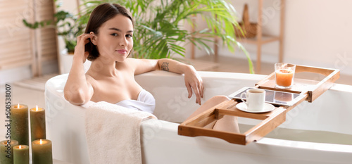 Beautiful young woman takin...