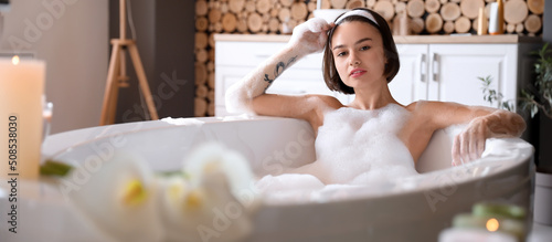 Beautiful young woman takin...