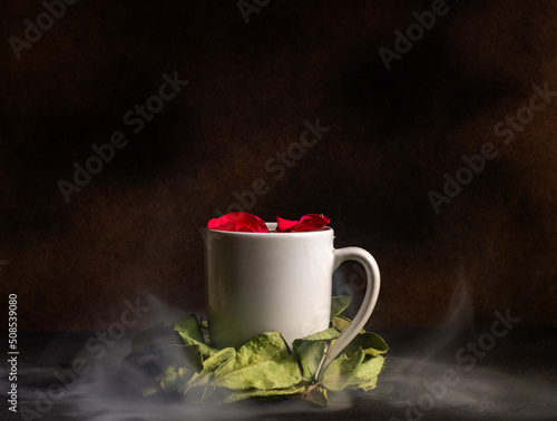 White coffee cup surrounded by flowers. Elegant coffee shop concept