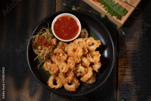Fried Calamari with Kecombrang Sauce is a pretty popular appetizer, though most people probably know them by their Indonesian name: cumi goreng tepung, literally squid fried with flour. photo