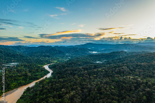 Gorgeous tropical forest background - a waterway under cloudscape of sunset, a beautiful nature background