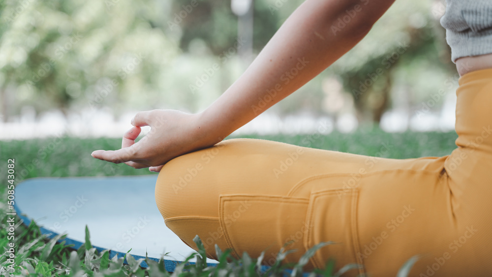 person relaxing on the grass, yoga conept.