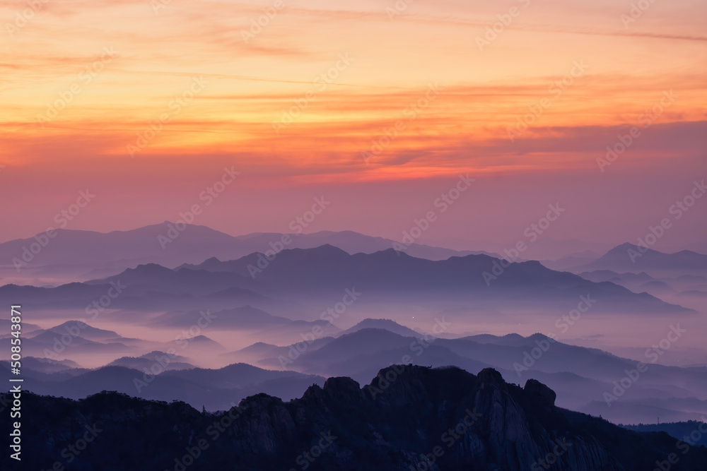 Scenic view of mountains against sky during sunrise