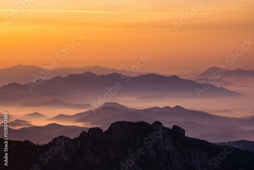 Scenic view of mountains against sky during sunrise © Sangoh