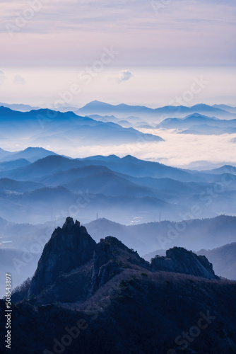 Scenic view of mountains against sky during sunrise © Sangoh