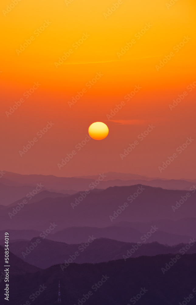 Scenic view of mountains against sky during sunrise Scenic view of mountains against sky during sunrise